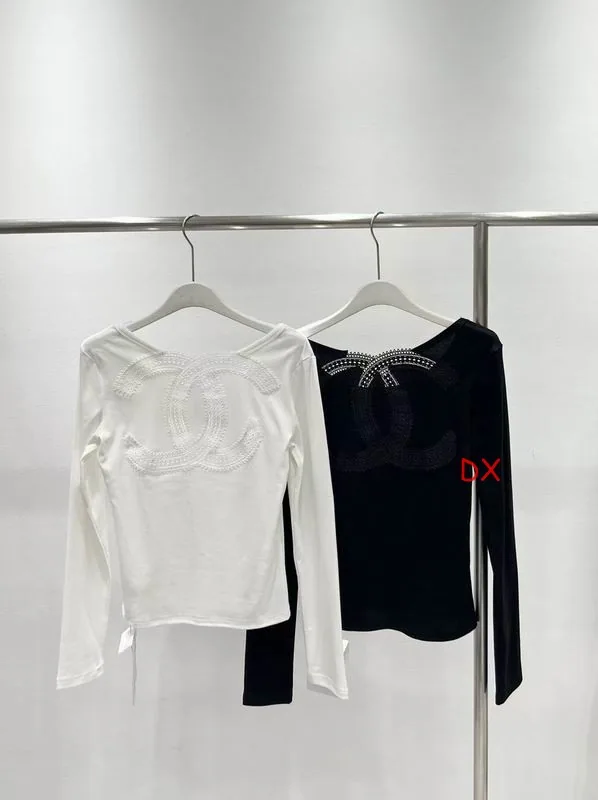 Black and white long-sleeve tops shown from the front for the clothing collection